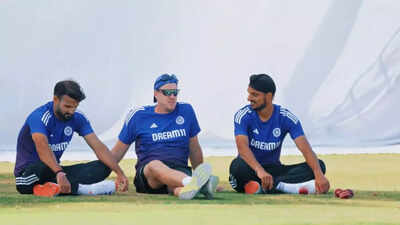 Arshdeep Singh and Akash Deep playfully wrestle with coach Morne Morkel