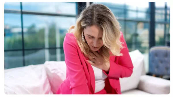 Person clutching their chest in pain