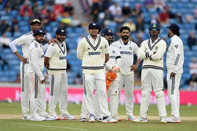 Indian team strategizes during a break in play