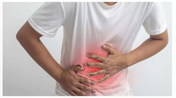 Person experiencing abdominal pain.